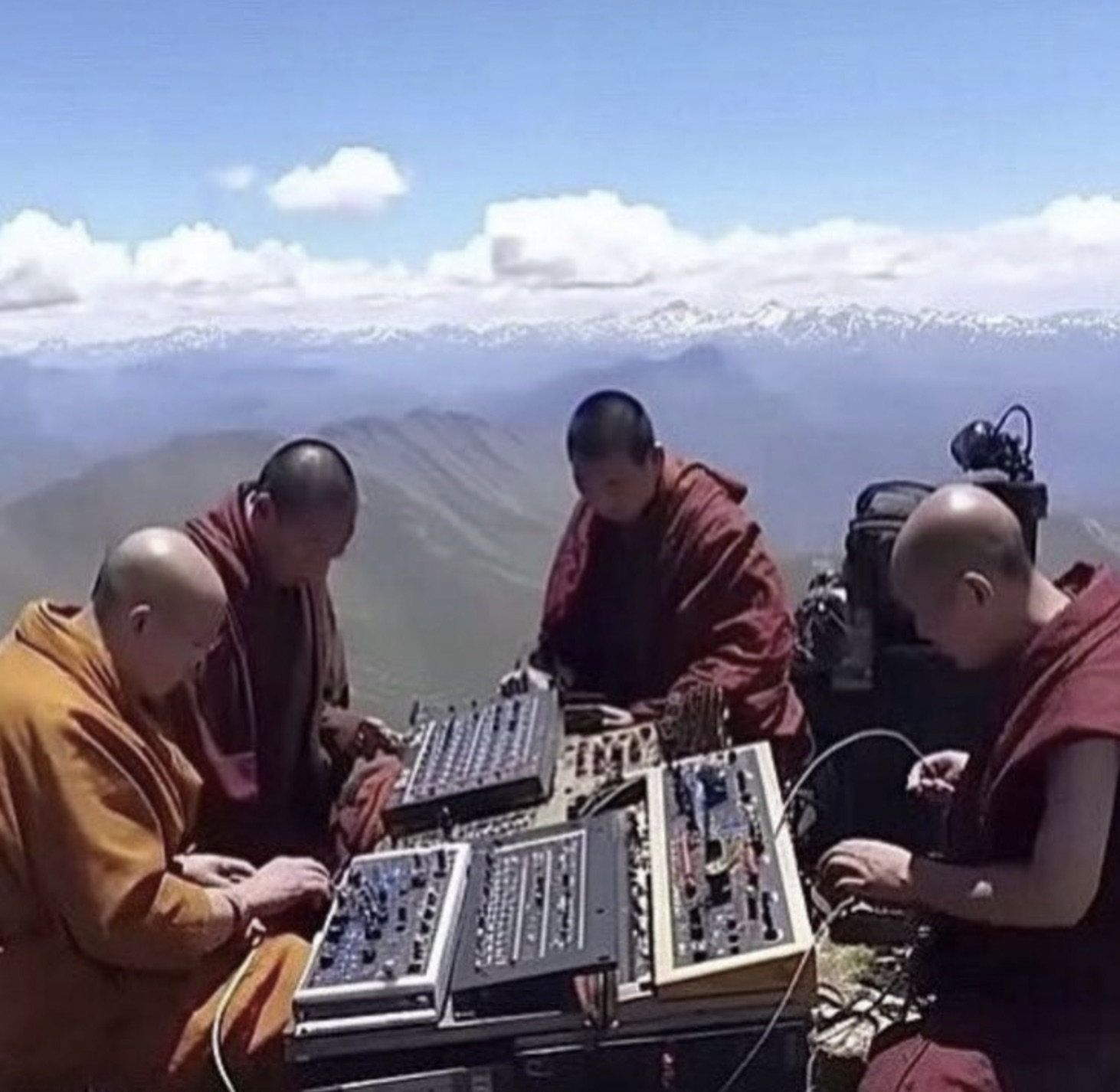 monks with synths on mountain